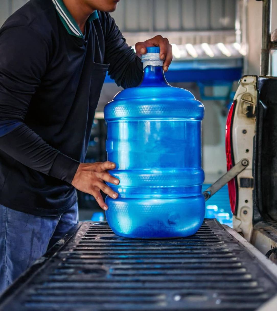 man loading water juhs